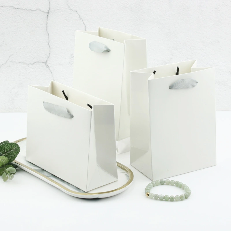 Presentpåsar av högkvalitativt texturerat papper